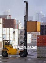 ID 1858 PORT OF AUCKLAND, NZ - A mast-lift truck working among container stacks, Axis Fergusson Container Terminal.